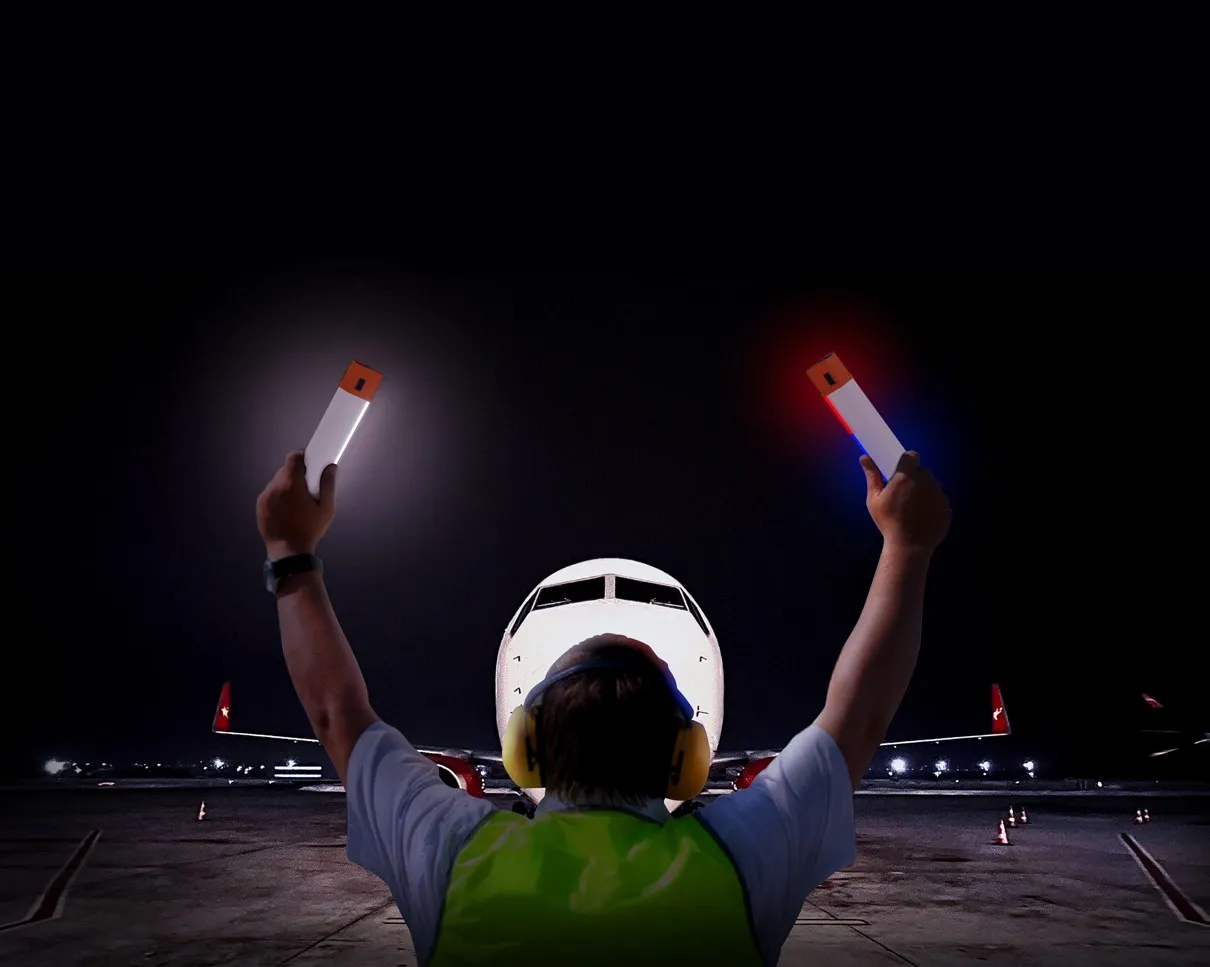 Two FLS-1 used for marshalling an aircraft at night